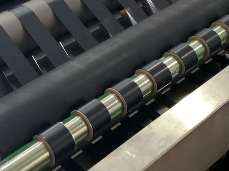 Tape slitting machine: sticky problems, neatly solved