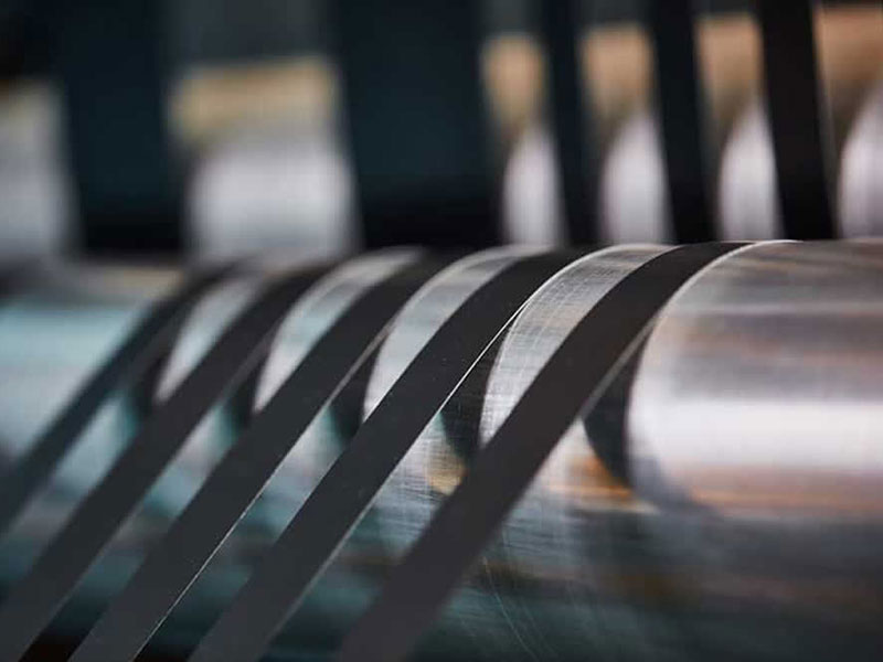 Tape slitting machine: sticky problems, neatly solved